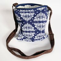 Less Is More- Ornamento in White on Blue Cross Body Bag