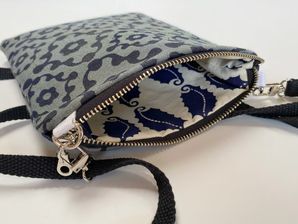 Less Is More- Knobby Blue Pattern on Dark Green Cross Body Bag